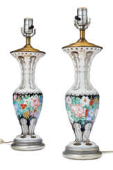 A PAIR OF BOHEMIAN WHITE OVERLAY CUT-GLASS VASES MOUNTED AS LAMPS