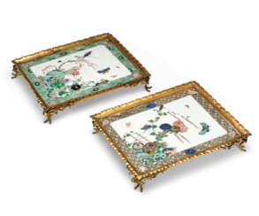 A PAIR OF FRENCH GILT-BRONZE MOUNTED CHINESE FAMILLE VERTE PORCELAIN TILES