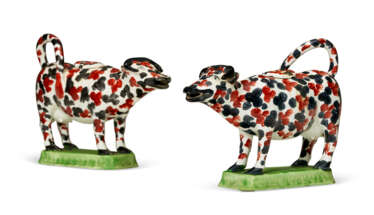 A PAIR OF PEARLWARE COW CREAMERS AND COVERS