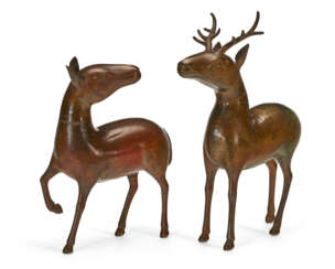 TWO CHINESE GILT-LAQUERED BRONZE FIGURES OF DEER