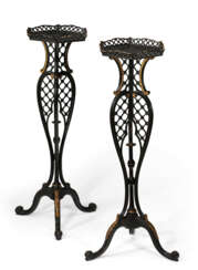 A PAIR OF GEORGE III BLACK-PAINTED AND PARCEL-GILT TORCH&#200;RES