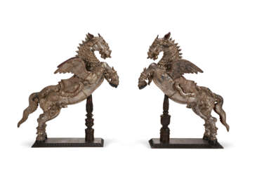 A PAIR OF CARVED, SILVERED AND PAINTED WOOD FIGURES OF RAMPANT HORSES