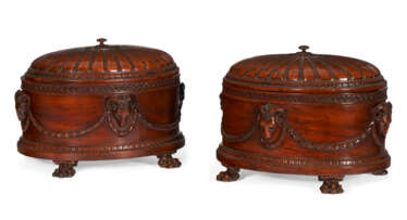 A PAIR OF GEORGE III STYLE MAHOGANY OVAL CASKETS