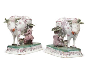 A PAIR OF DUTCH DELFT POLYCHROME MILKING GROUPS
