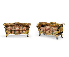 A MATCHED PAIR OF VICTORIAN PARCEL-GILT AND MOTHER-OF-PEARL INLAID PAPIER M&#194;CH&#201; EBONIZED SETTEES