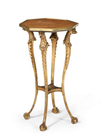 A REGENCY AMBOYNA AND PARCEL-GILT CENTER TABLE - photo 1