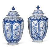 A PAIR OF DUTCH DELFT BLUE AND WHITE VASES AND COVERS - photo 1