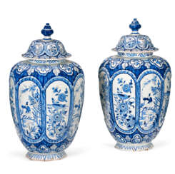 A PAIR OF DUTCH DELFT BLUE AND WHITE VASES AND COVERS