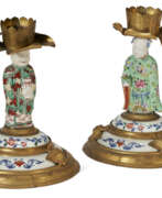 Chinoiserie. A PAIR OF ASSEMBLED GILT-METAL AND CHINESE EXPORT AND JAPANESE PORCELAIN CANDLESTICKS