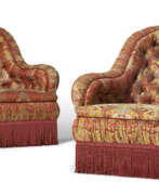 Upholstery. A NEAR PAIR OF VICTORIAN ARMCHAIRS