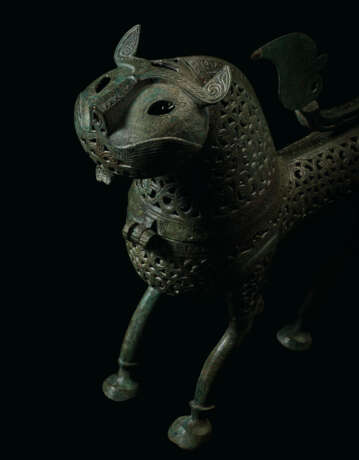 A LARGE AND IMPRESSIVE KHORASSAN ENGRAVED AND PIERCED BRONZE INCENSE BURNER IN THE FORM OF A LION - photo 2