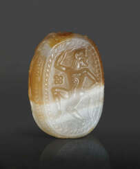 AN ETRUSCAN BANDED AGATE SCARAB WITH A DANCING SATYR