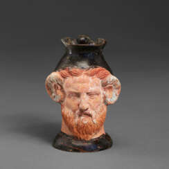 AN APULIAN POTTERY FIGURAL CHOUS IN THE FORM OF ZEUS-AMMON