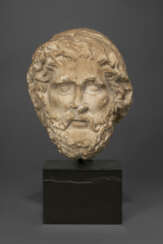 A ROMAN MARBLE HEAD OF ASCLEPIUS