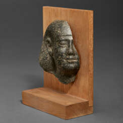 A FRAGMENTARY EGYPTIAN GRANITE PORTRAIT HEAD OF A MAN