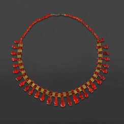 AN EGYPTIAN CARNELIAN AND RED JASPER BEAD NECKLACE WITH POPPY PENDANTS