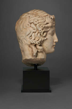 A ROMAN MARBLE HEAD OF THE EROS OF CENTOCELLE - photo 5