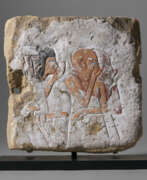 Limestone. AN EGYPTIAN SANDSTONE AND PAINTED PLASTER RELIEF FRAGMENT