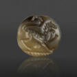 A GREEK BROWN SERPENTINE LENTOID ISLAND GEM WITH A LION - Auction prices