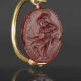 A GREEK GOLD AND CARNELIAN SCARAB SWIVEL RING WITH AN AMAZON - photo 1