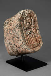 AN EGYPTIAN RED GRANITE CARTOUCHE FOR RAMESSES II