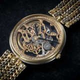 GÉRALD GENTA REF. G1513, A FINE TWO-TONE GOLD SKELETONISED WRISTWATCH WITH DIAMOND OUTER MINUTE TRACK INLAY - Foto 1