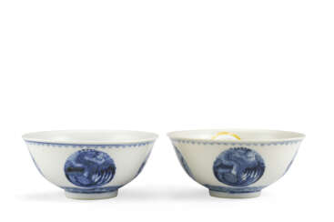 Two blue and white porcelain bowls with dragon and phoenix medallion, bearing Guanxu mark on the base