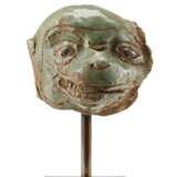 A green glazed ceramic head of a monkey - photo 1