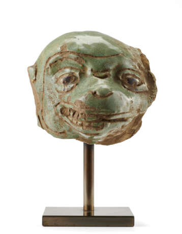 A green glazed ceramic head of a monkey - photo 1