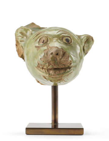 A green glazed ceramic head of a feline - фото 1