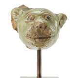 A green glazed ceramic head of a feline - фото 1