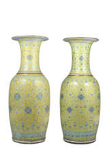 Two large yellow ground balauster vases each ovoid body rising to a tall trumpet neck