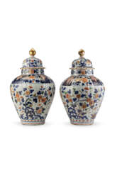 A pair of Imari porcelain potiches with flower decorations
