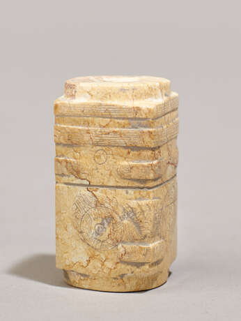 A CONG-SHAPED BEAD IN WHITENED JADE WITH RUSSET VEINS DECORATED WITH FINELY RENDERED MASKS - photo 2