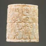 AN INTERESTING THICK EARRING OF THE JUE TYPE IN PARTLY CALCIFIED WHITE JADE DECORATED WITH STYLIZED DRAGON HEADS - фото 6