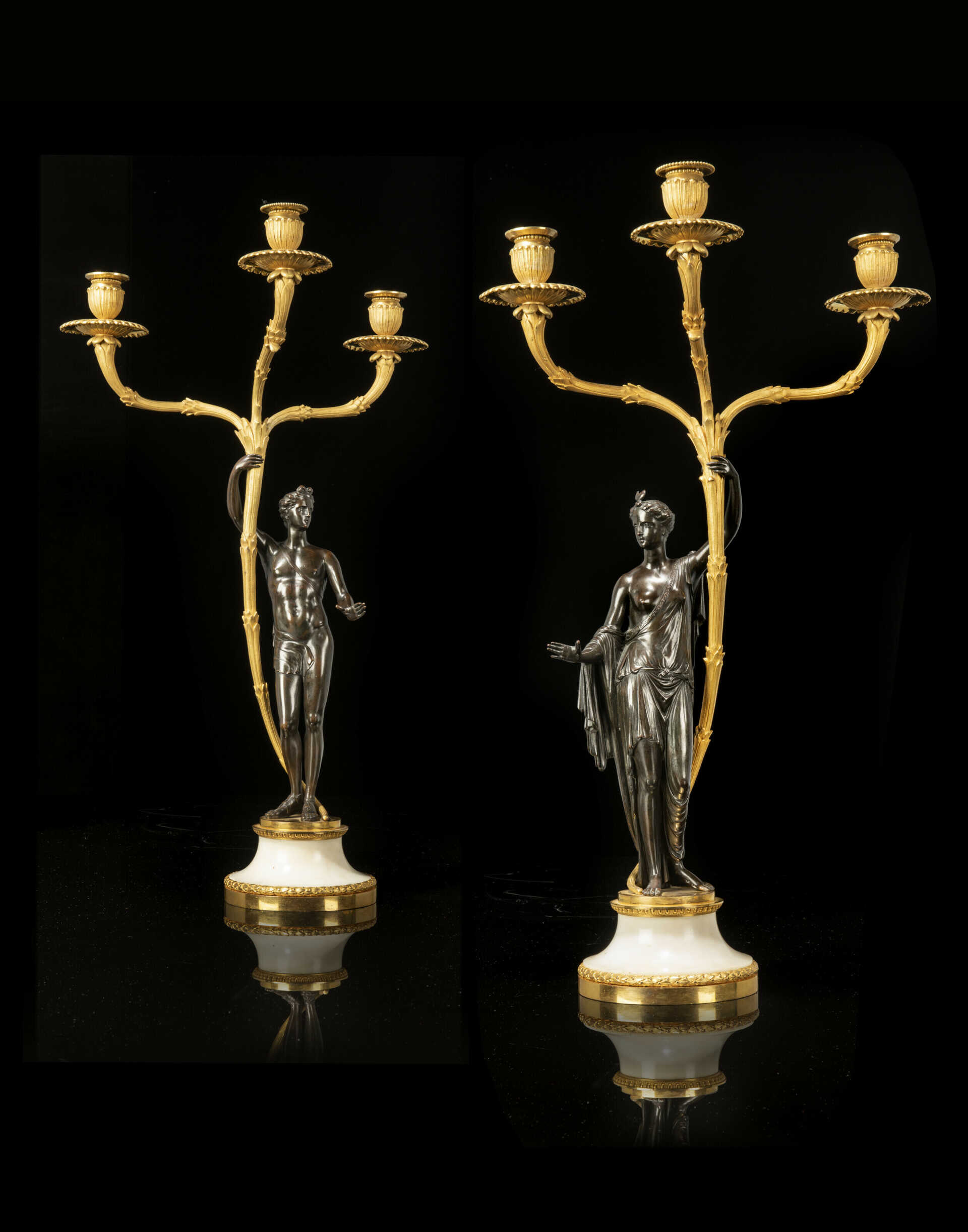 A PAIR OF GEORGE III ORMOLU, PATINATED-BRONZE AND WHITE MARBLE `APOLLO AND DIANA' CANDELABRA