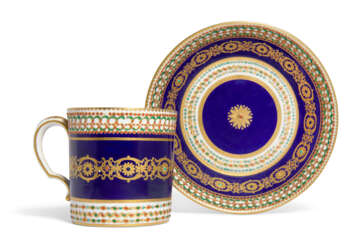 A SEVRES PORCELAIN BEAU BLEU 'JEWELLED' CUP AND SAUCER (GOBELET LITRON ET SOUCOUPE, 1ERE GRANDEUR)