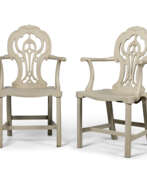 Thomas Chippendale. A PAIR OF GEORGE III STONE-PAINTED WALNUT HALL CHAIRS
