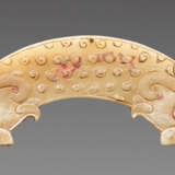 A POWERFUL HUANG ARCHED PENDANT WITH FINELY DETAILED DRAGON HEADS AND A PATTERN OF RAISED CURLS - photo 1