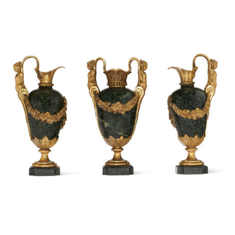 A FRENCH ORMOLU-MOUNTED AND GREEN SERPENTINE THREE-PIECE MATCHED GARNITURE - photo 1