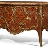 A FRENCH ORMOLU-MOUNTED BOIS SATINE, MAHAOGANY AND BOIS-DE-BOUT MARQUETRY COMMODE - фото 1