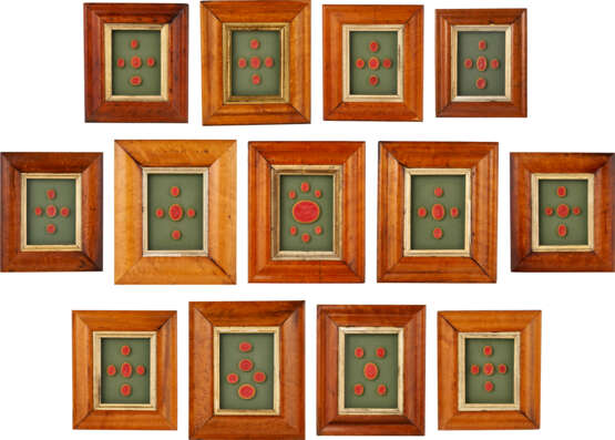 A GROUP OF THIRTEEN FRAMED SETS OF INTAGLIO SEALS AND MOLDS - photo 1