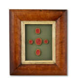 A GROUP OF THIRTEEN FRAMED SETS OF INTAGLIO SEALS AND MOLDS - photo 18