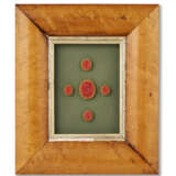 A GROUP OF THIRTEEN FRAMED SETS OF INTAGLIO SEALS AND MOLDS - photo 22