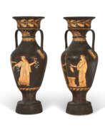 Iron. A PAIR OF CAST-IRON TWIN-HANDLED VASES