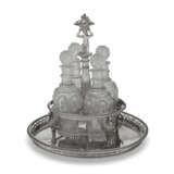 A FRENCH SILVER CRUET STAND AND FOUR CUT GLASS BOTTLES AND STOPPERS - photo 1
