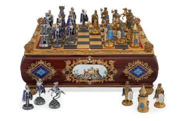 A CONTINENTAL SILVER-GILT AND ENAMEL-MOUNTED MAHOGANY CHESS SET AND BOARD