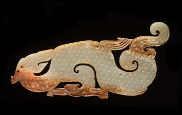 A SUPERB AND EXTREMELY RARE LARGE DRAGON-SHAPED PLAQUE CARVED IN WHITE JADE 