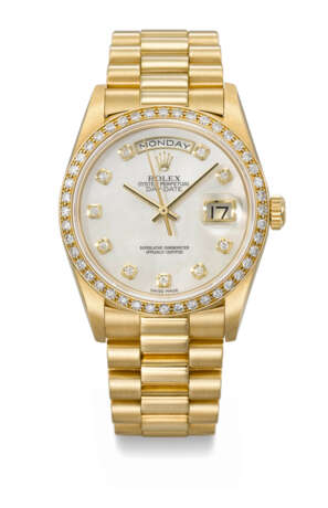 ROLEX. A RARE AND ATTRACTIVE 18K GOLD AND DIAMOND-SET AUTOMATIC WRISTWATCH WITH SWEEP CENTRE SECONDS, DAY, DATE, MOTHER-OF PEARL DIAL AND BRACELET - photo 1