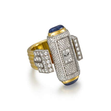 JAEGER-LECOULTRE. A HIGHLY ATTRACTIVE TWO-COLOUR GOLD, DIAMOND AND CABOCHON SAPPHIRE-SET BACK WINDING RING WATCH - фото 1